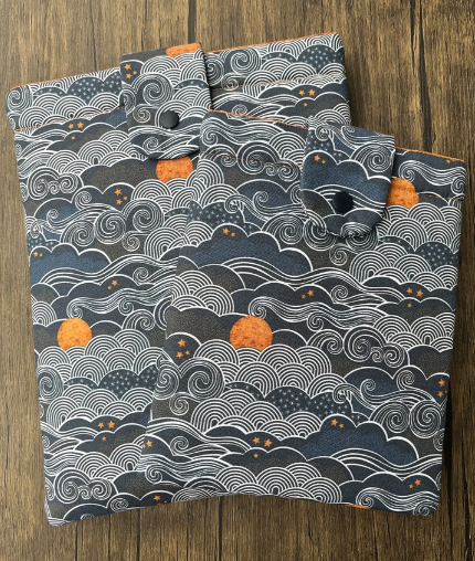 Waves and Orange Moon Padded Book Sleeve with closure