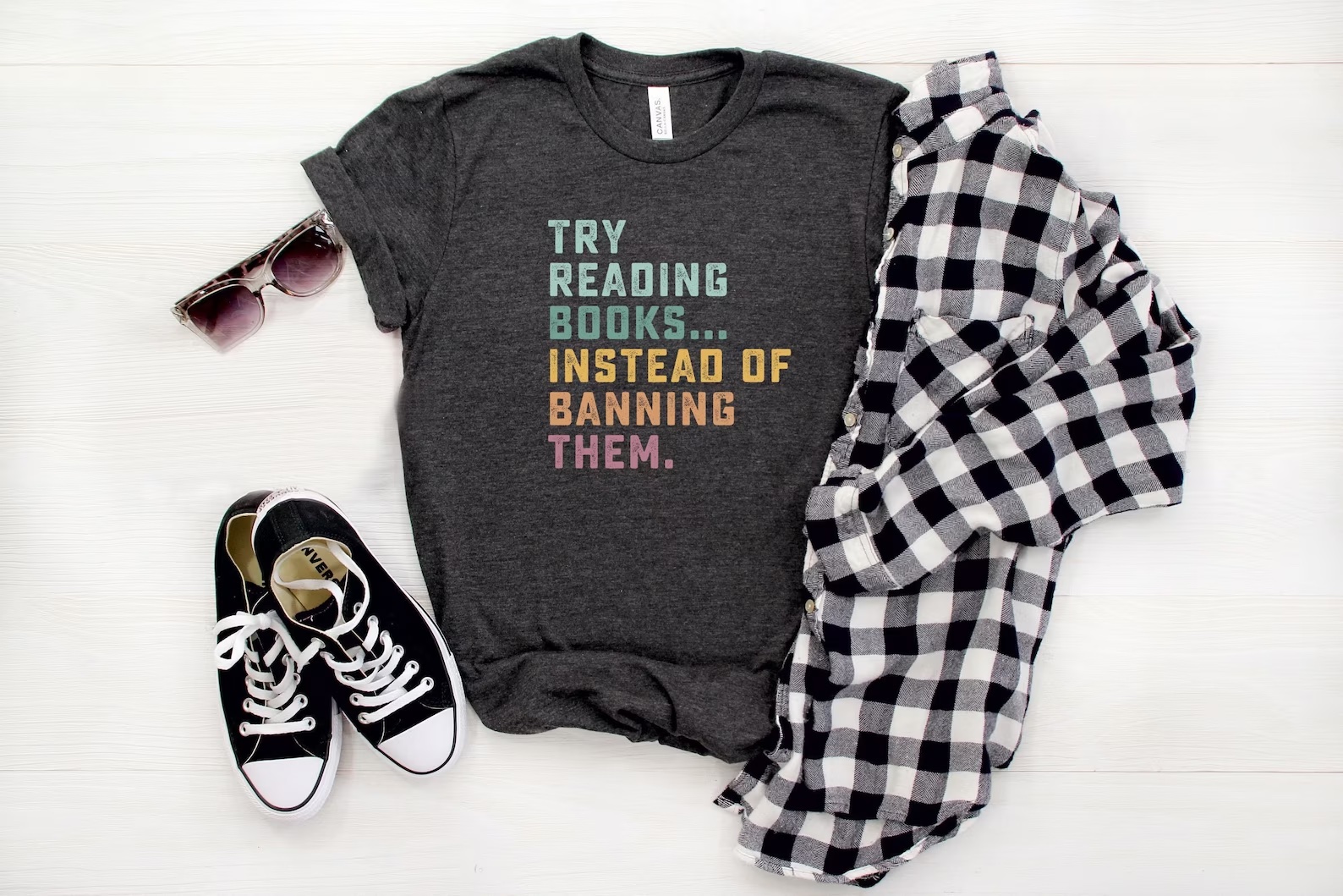 a photo of a t-shirt that reads "Try Reading Books . . . Instead of Banning Them