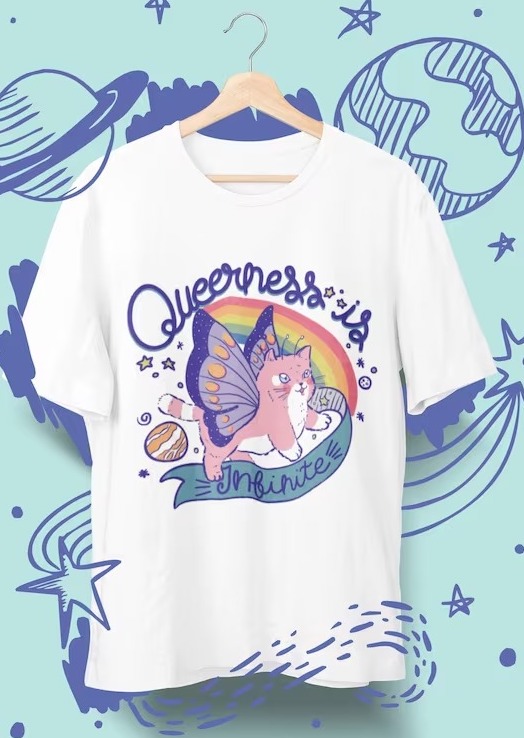 a shirt with a fairy cat on it and the text "queerness is infinite"