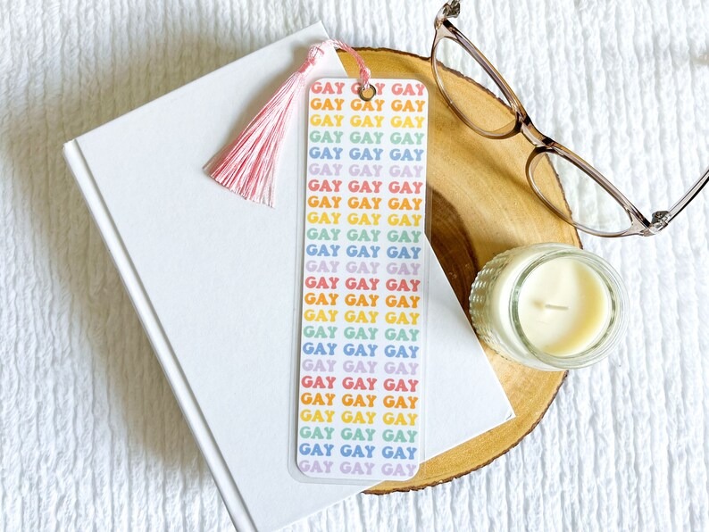 a bookmark with the word gay repeated over and over in rainbow colors