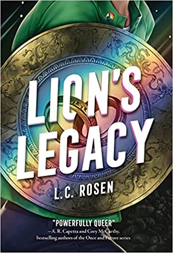 cover of Lion's Legacy by L. C. Rosen; image of young person in a green shirt holding a gold shield with a rainbow reflection on it