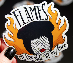 graphic illustration sticker of Mrs White from Clue film with flames on the side of her head with the quote "flames on the side of my face"