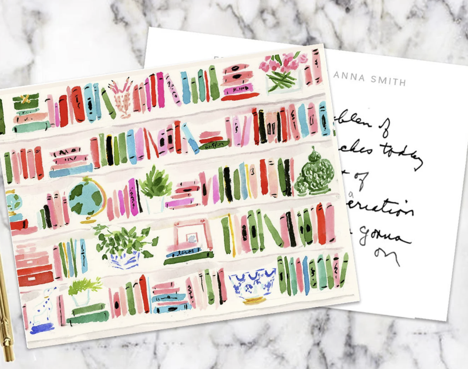 Stationary cards illustrated with colorful watercolor bookshelves