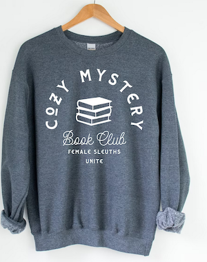 grey sweatshirt with a graphic that says cozy mystery book club female sleuths unite