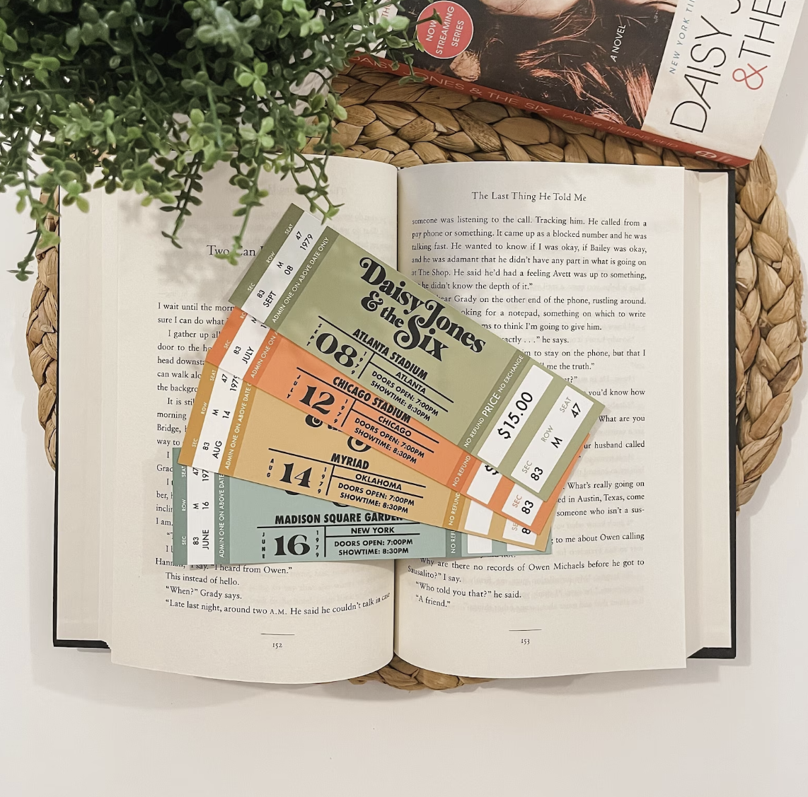 Colorful bookmarks designed to look like concert tickets to Daisy Jones and the Six performances.