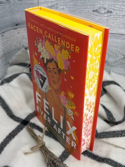 a photo of Felix Ever After with floral painting on the page edge matching the cover