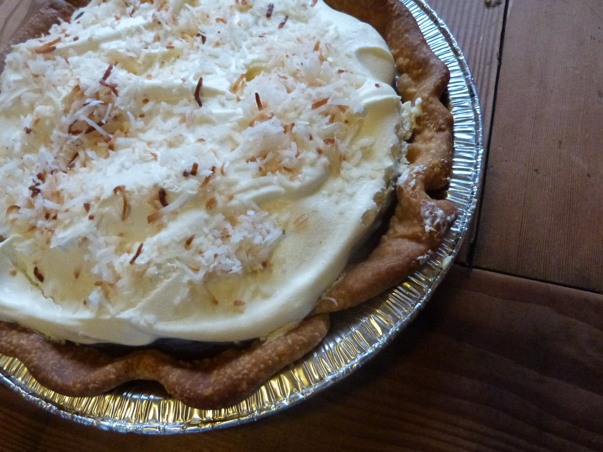 pie with whipped cream and coconut topping