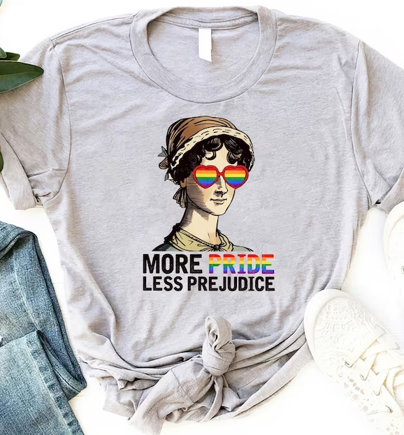 a shirt with a portrait of Jane Austen wearing rainbow sunglasses and the text "More Pride [in rainbow text], less prejudice"