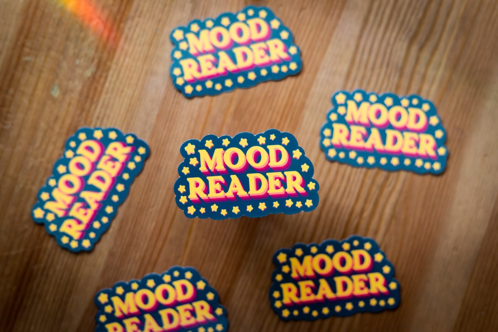 magnet in bright colors that reads "mood reader."