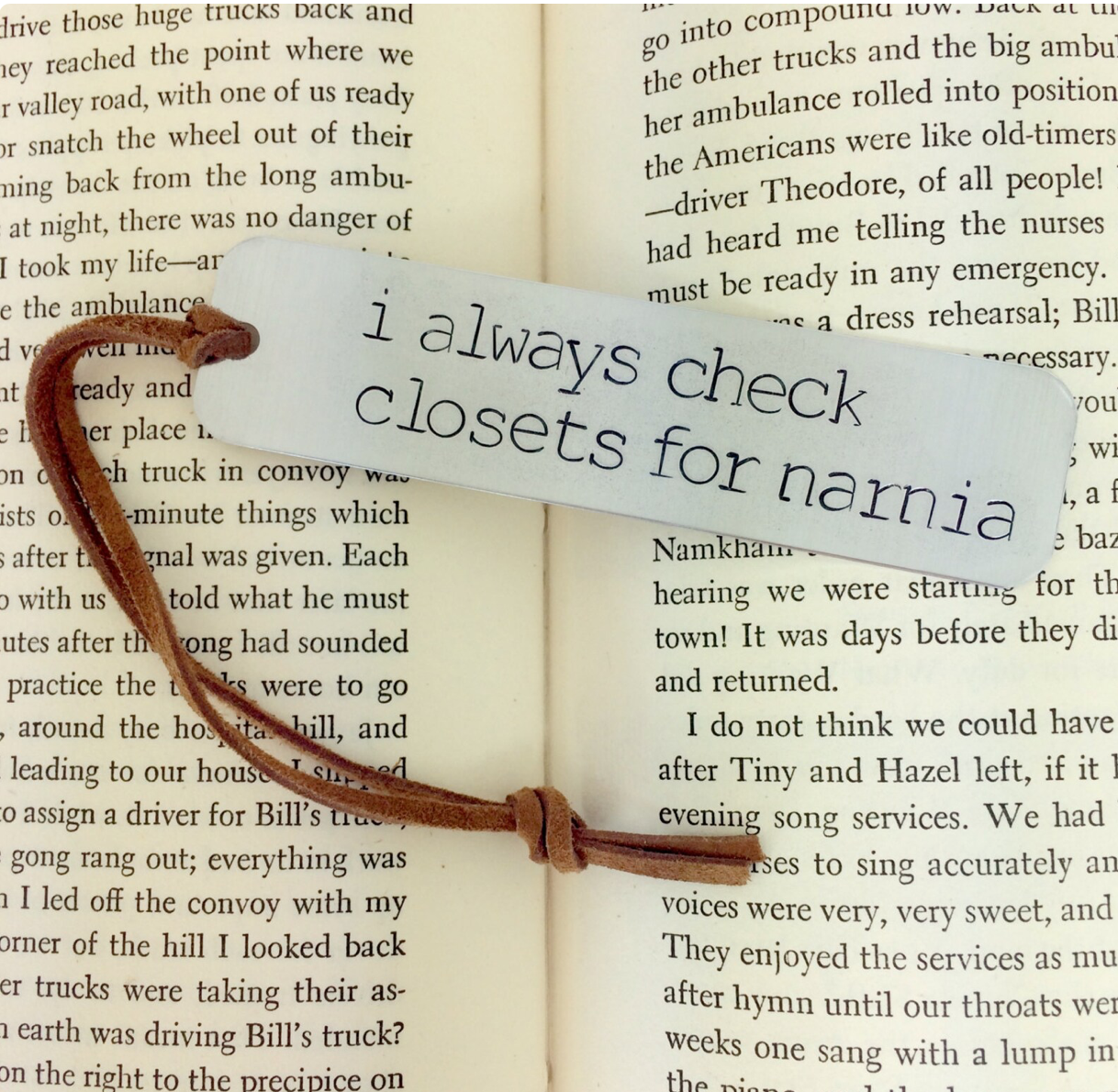 Silver bookmark that says "I always check closets for Narnia"