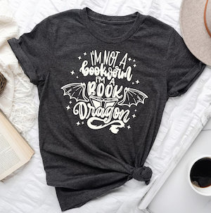 dark grey tshirt with graphic letters that say "I'm not a bookworm I'm a book dragon"