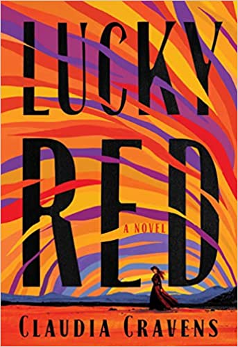 cover of Lucky Red by Claudia Cravens; woman in frontier wear standing under a sky of reds, oranges, and purples