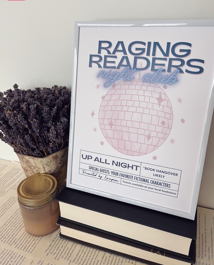 image of a print that says raging readers night club, and it features a big pink disco ball. 