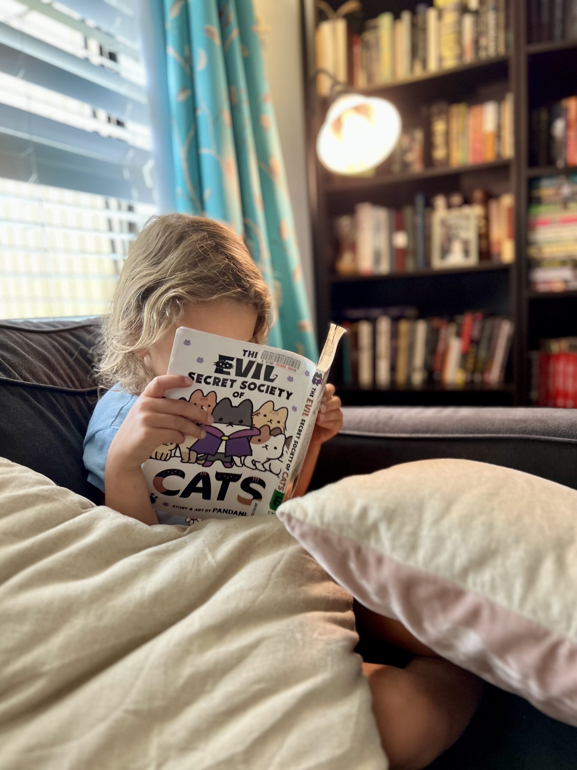 Marian reading cat book, the kids are all right
