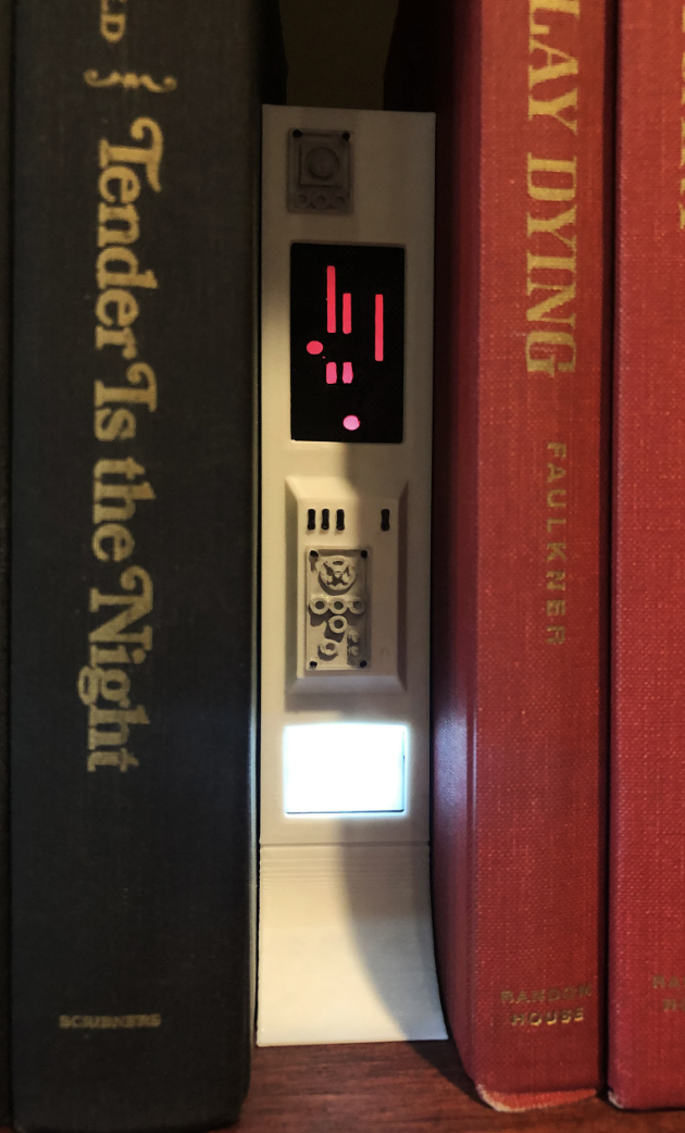 a photo of a mini scifi book nook that looks like spaceship controls