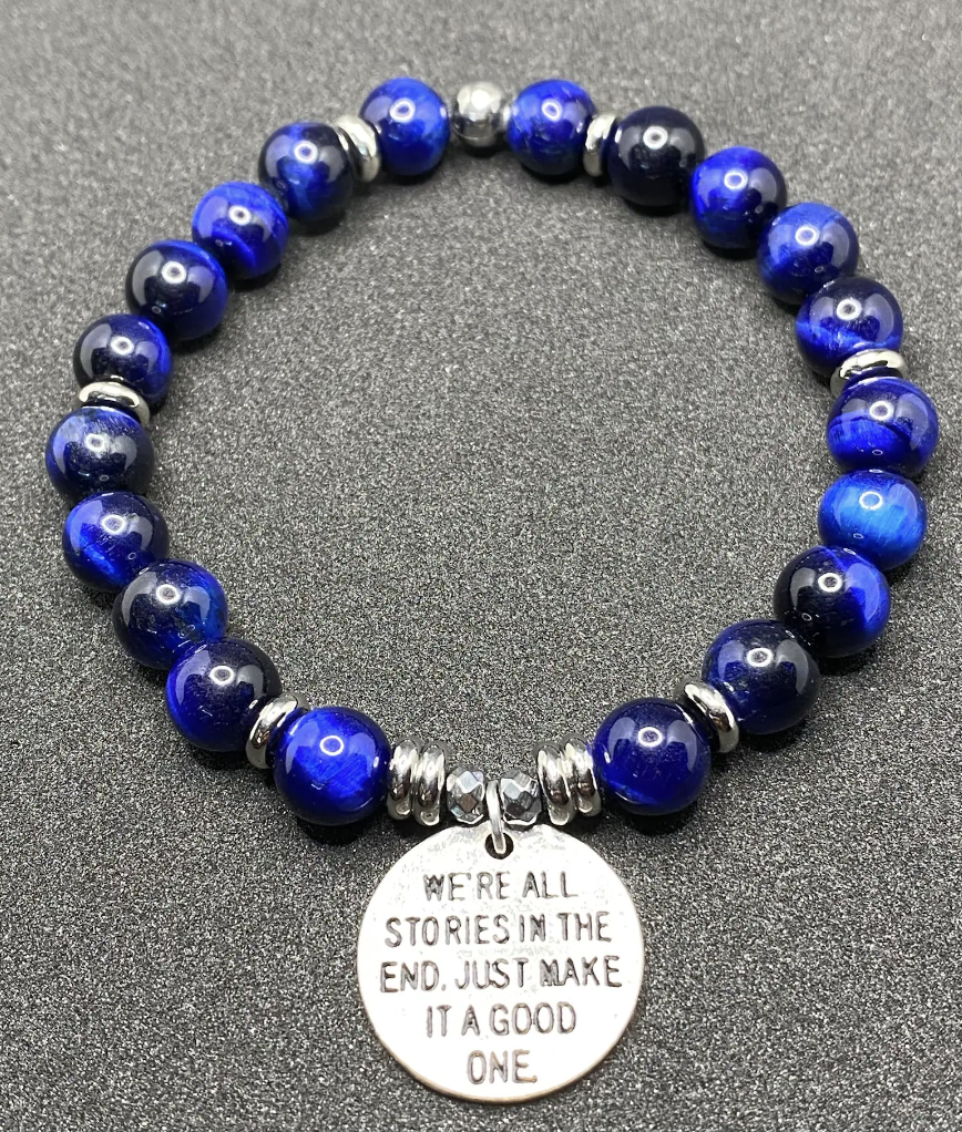 Bracelet with a charm that reads "We're all stories in the end. Just make it a good one."