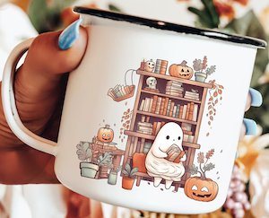 a beige coffee mug with an illustration of a bookshelf and pumpkins with a ghost sitting reading a book