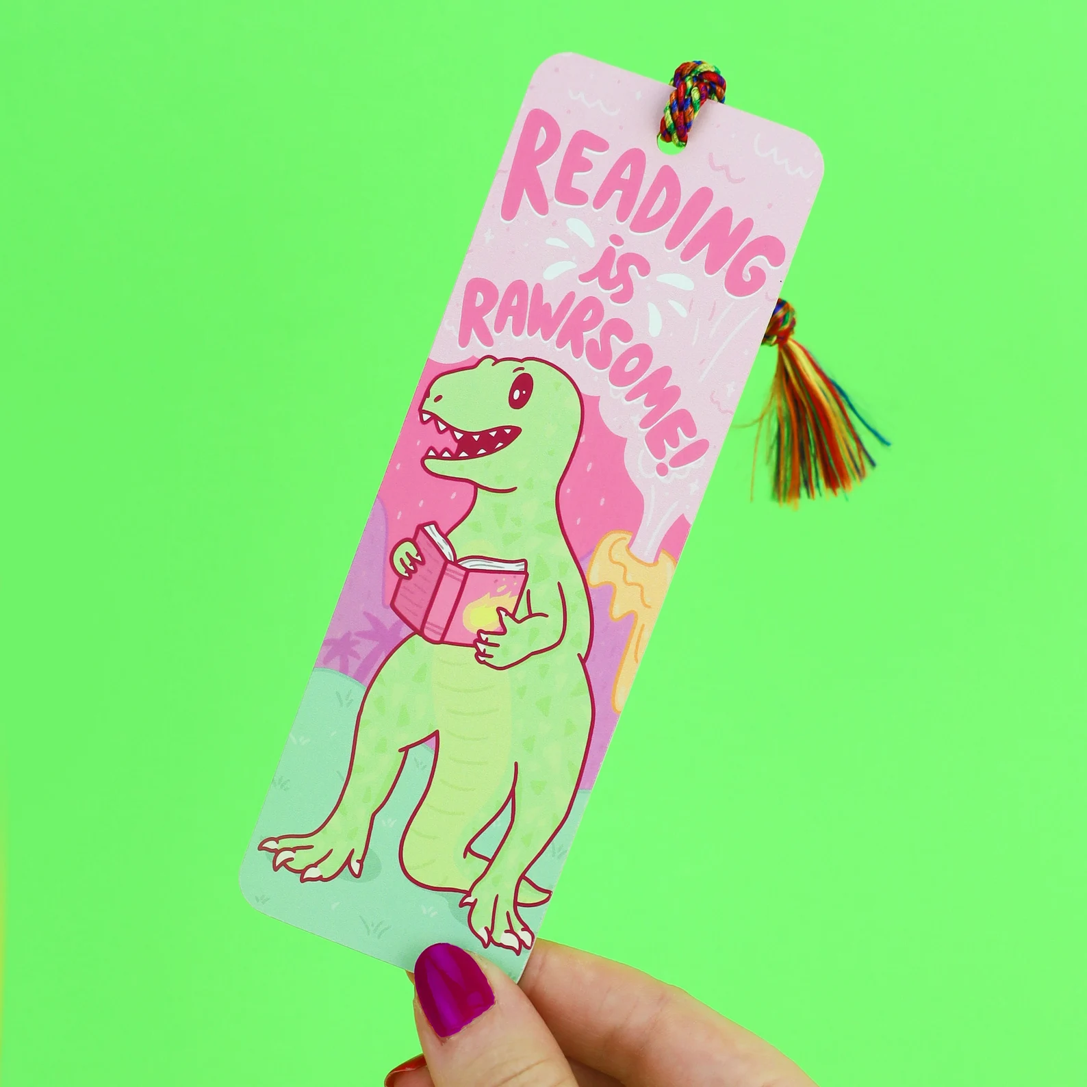 dinosaur book mark on green background