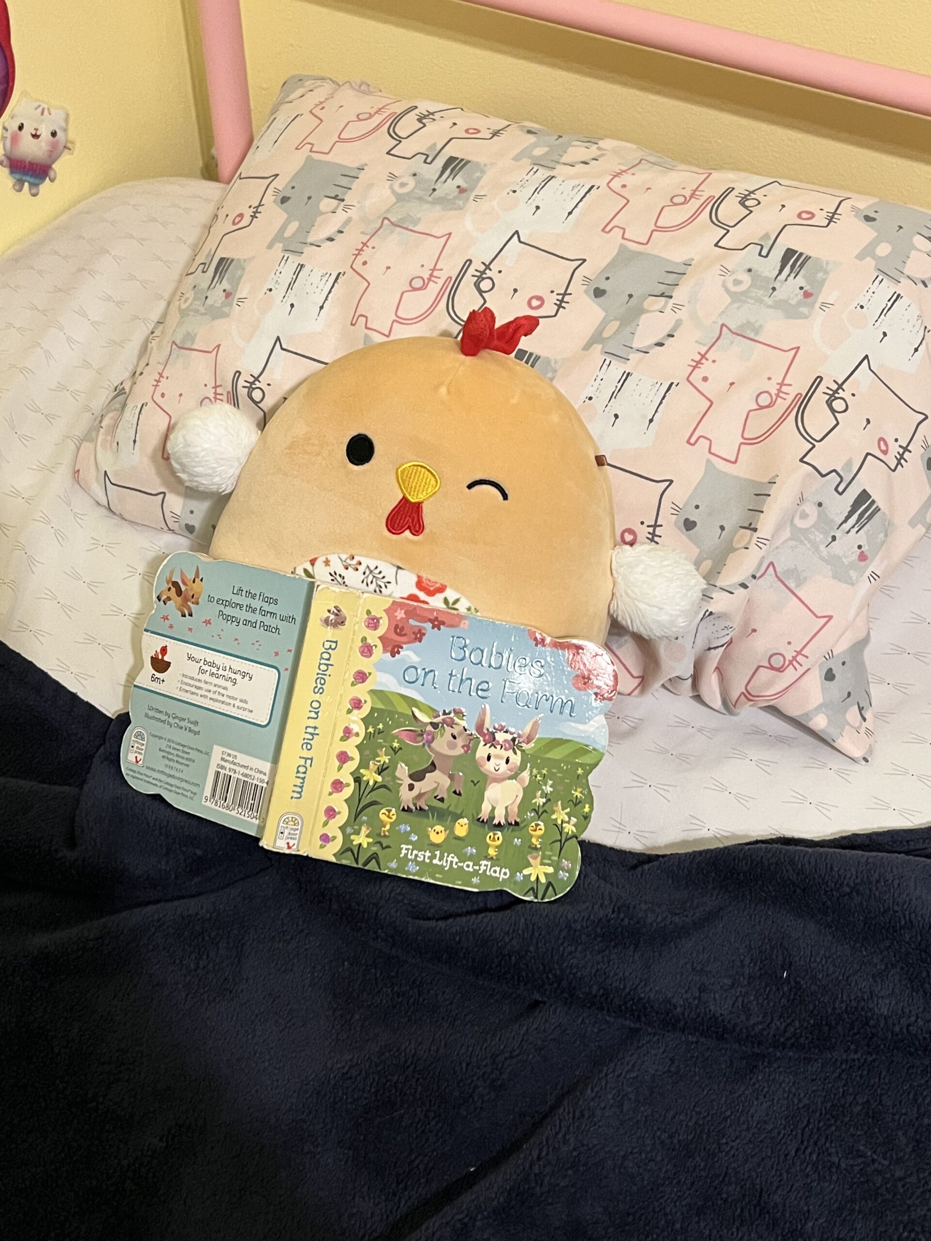 Stuffed Animal with a book, the kids are all right