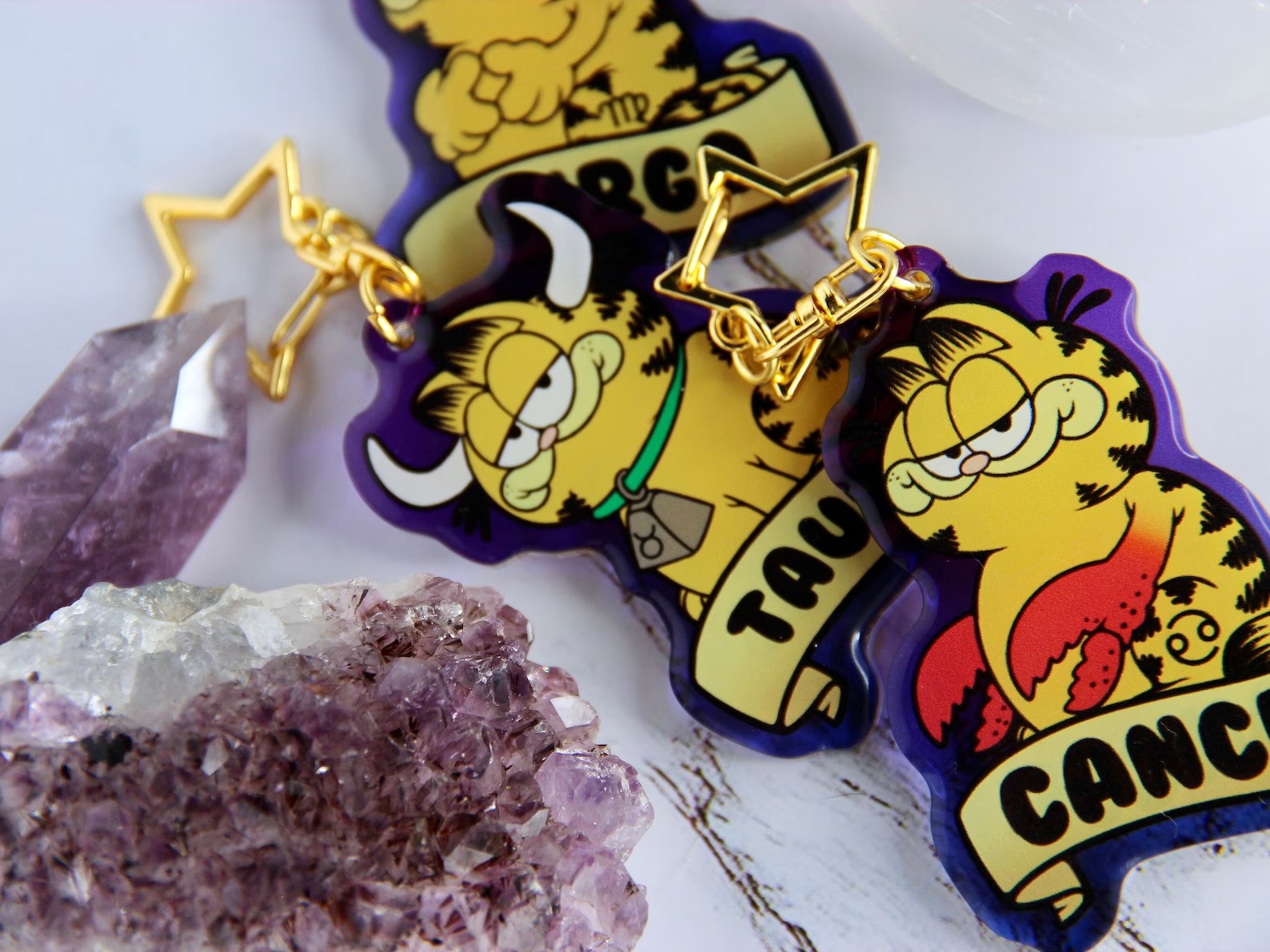 Charms with images of Garfield representing each of the zodiac signs