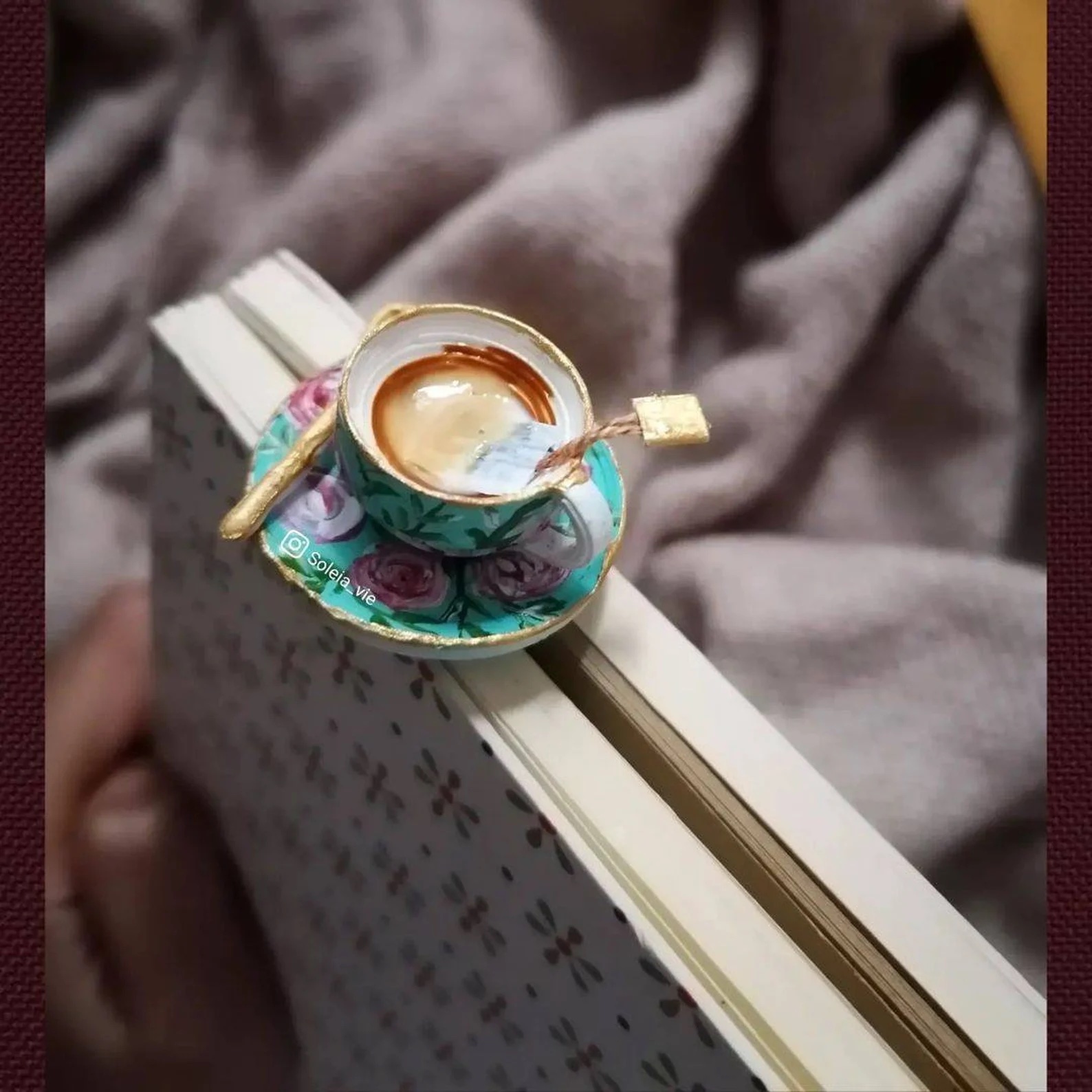 a photo of a cup of tea bookmark featuring a 3d cup of tea on the top of the bookmark