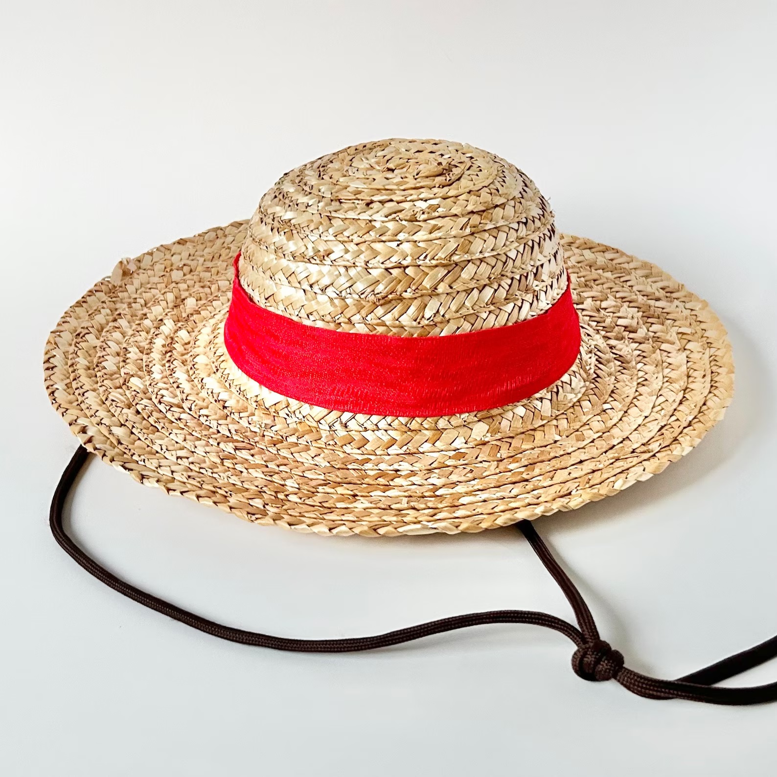 A straw hat patterned after the one Monkey D Luffy wears in One Piece
