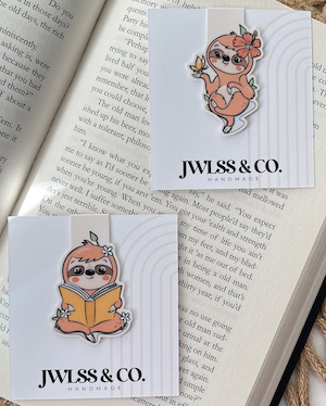 magnetic book marks of a sloth playing with a butterfly and a sloth reading a book