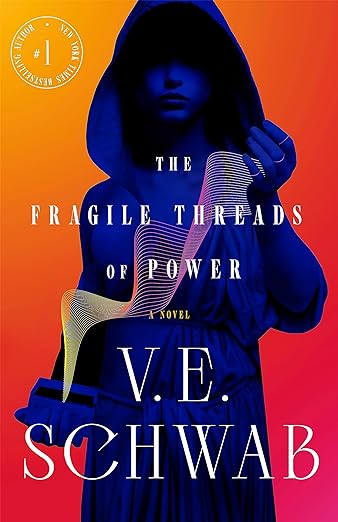 cover of The Fragile Threads of Power by V.E. Schwab; blue-tinted image of person in hooded robe hold white waves of energy