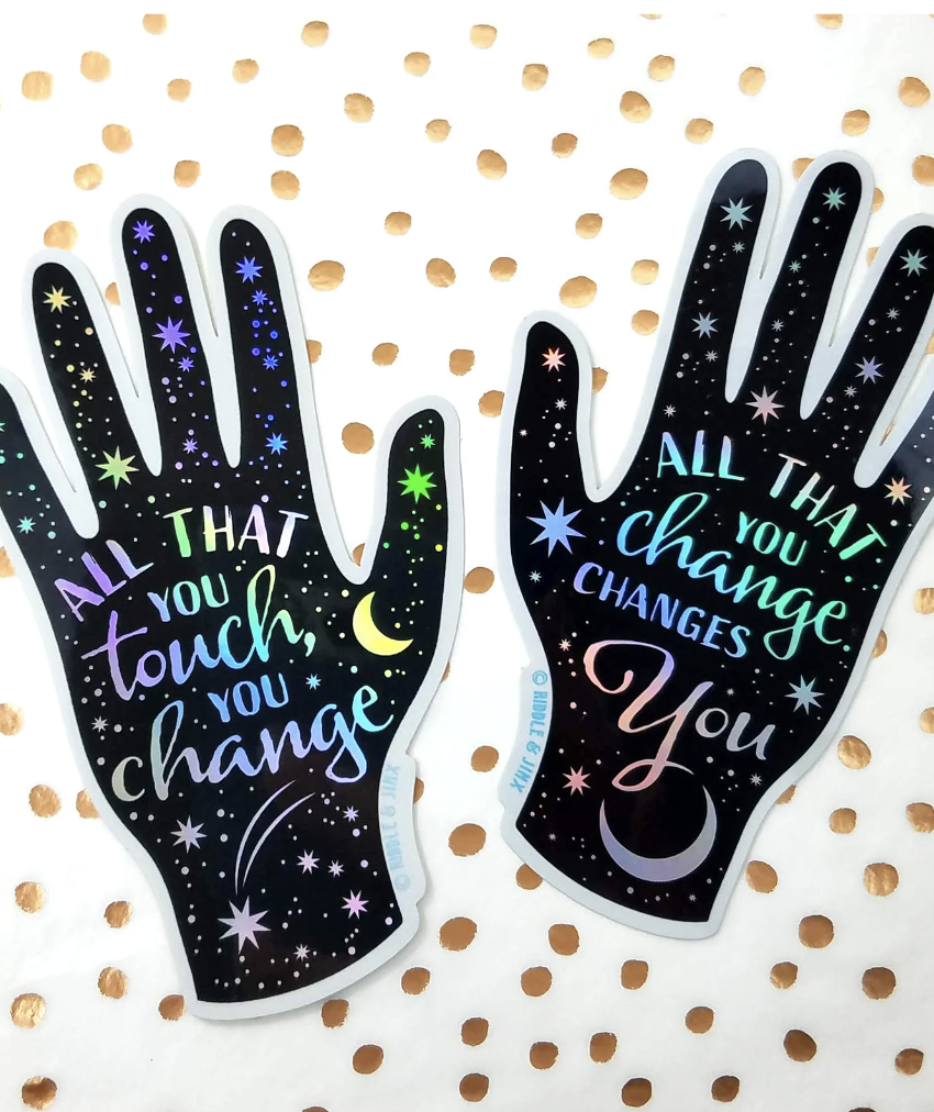 "All that you touch, you change." "All that you change, changes you." on two hand-shaped stickers