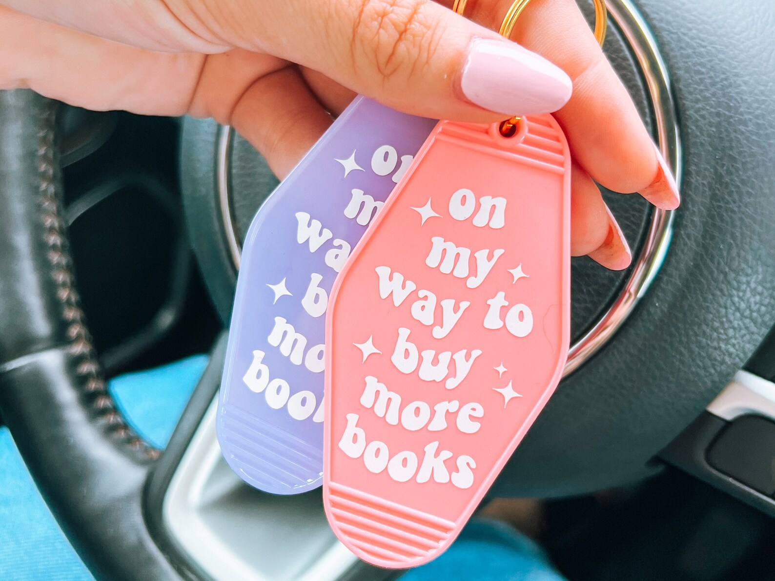 on my way to buy more books keychain