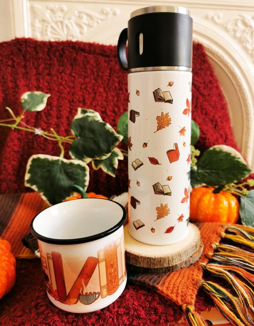 Image of a thermos with books and leaves