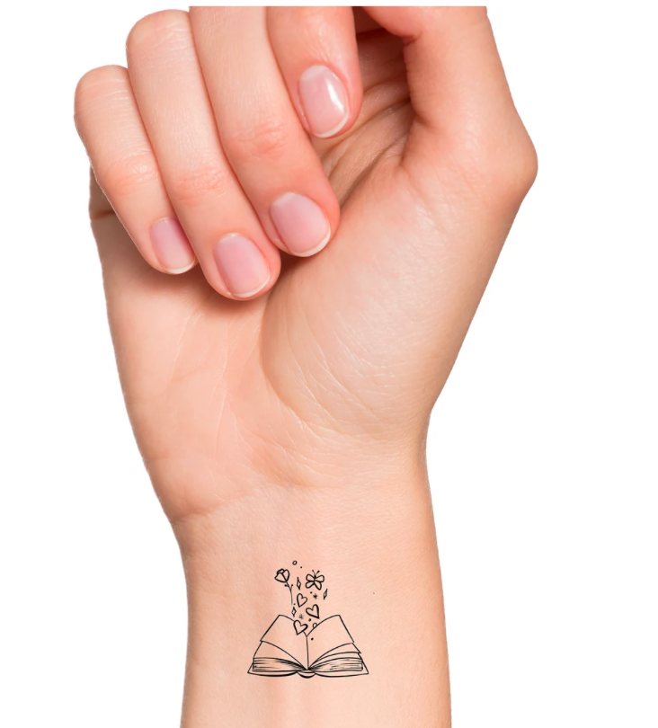 Temporary tattoo with open book and flowers emerging from the inside