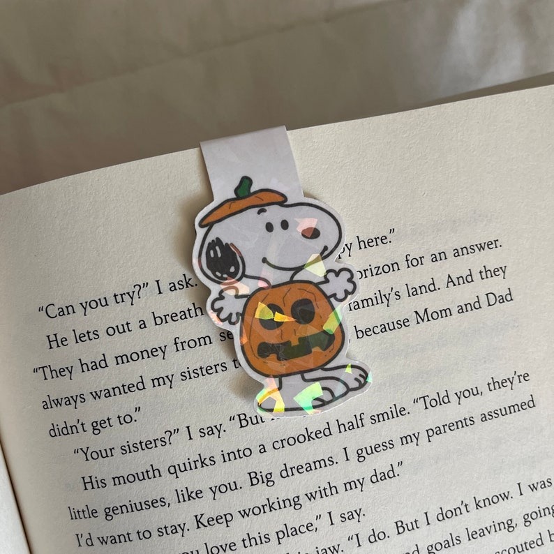a magnetic Snoopy dressed as a pumpkin bookmark