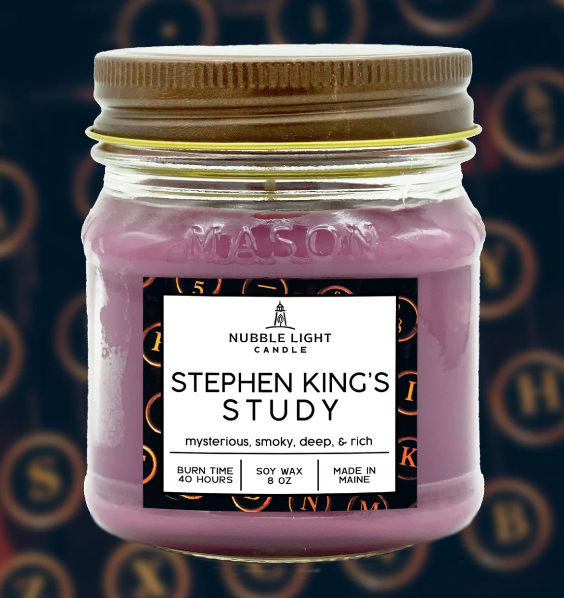 Purple candle that says Stephen King's Study