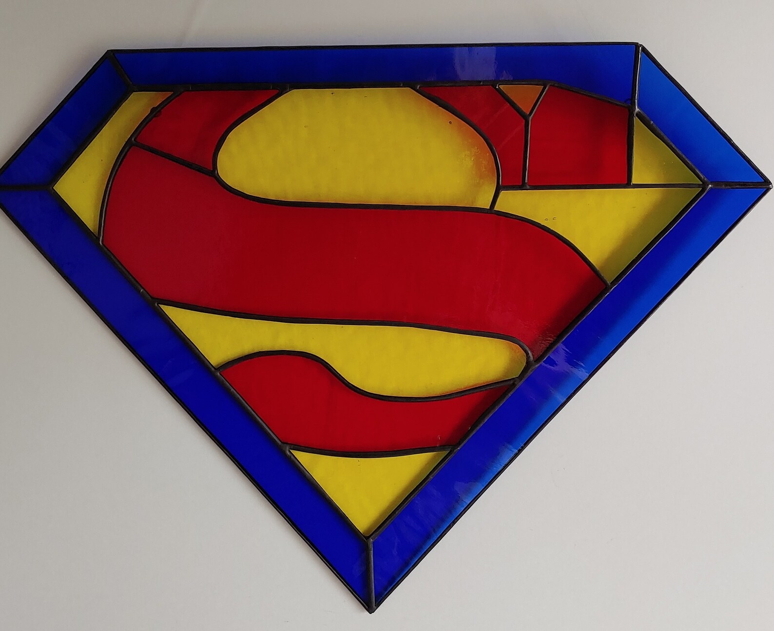 Superman's logo made with stained glass