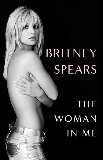 cover of The Woman in Me by Britney Spears; black and white photo of Spears topless in silver pants