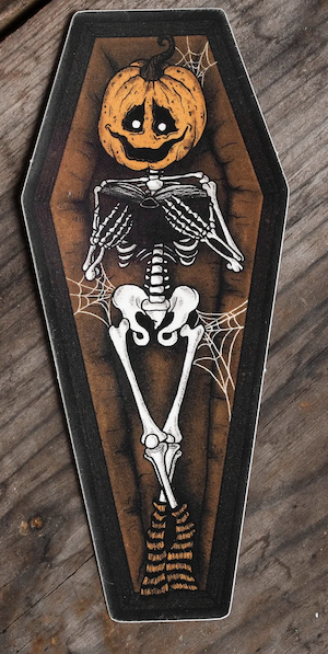 vinyl sticker of a coffin with a skeleton with a pumpkin head reading a book