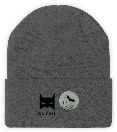 A gray beanie. The bottom portion features an image of Batman's cowl over the words "on call." Beside it is a full moon with the Bat-signal on it.