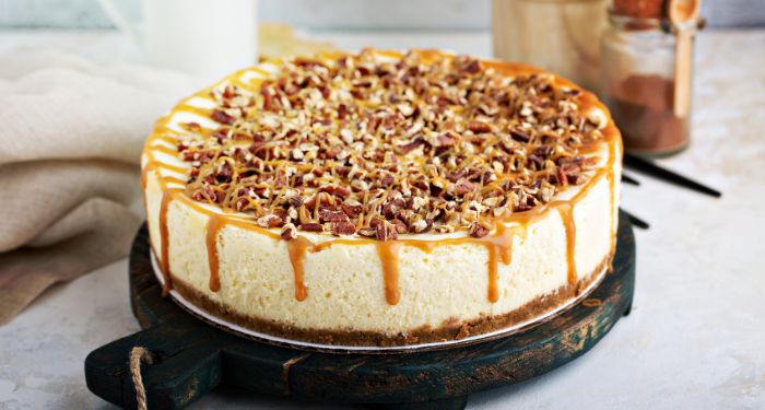 cheesecake topped with caramel and pecans