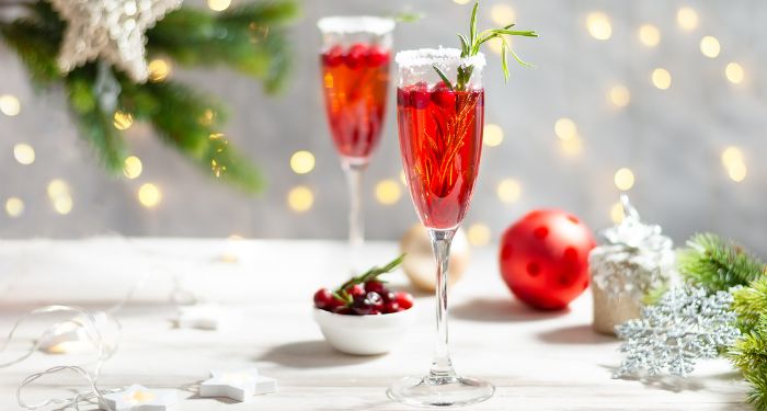 red cocktail in champagne flute