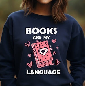 a navy sweatshirt with pink graphic book and white text saying Books Are My Language