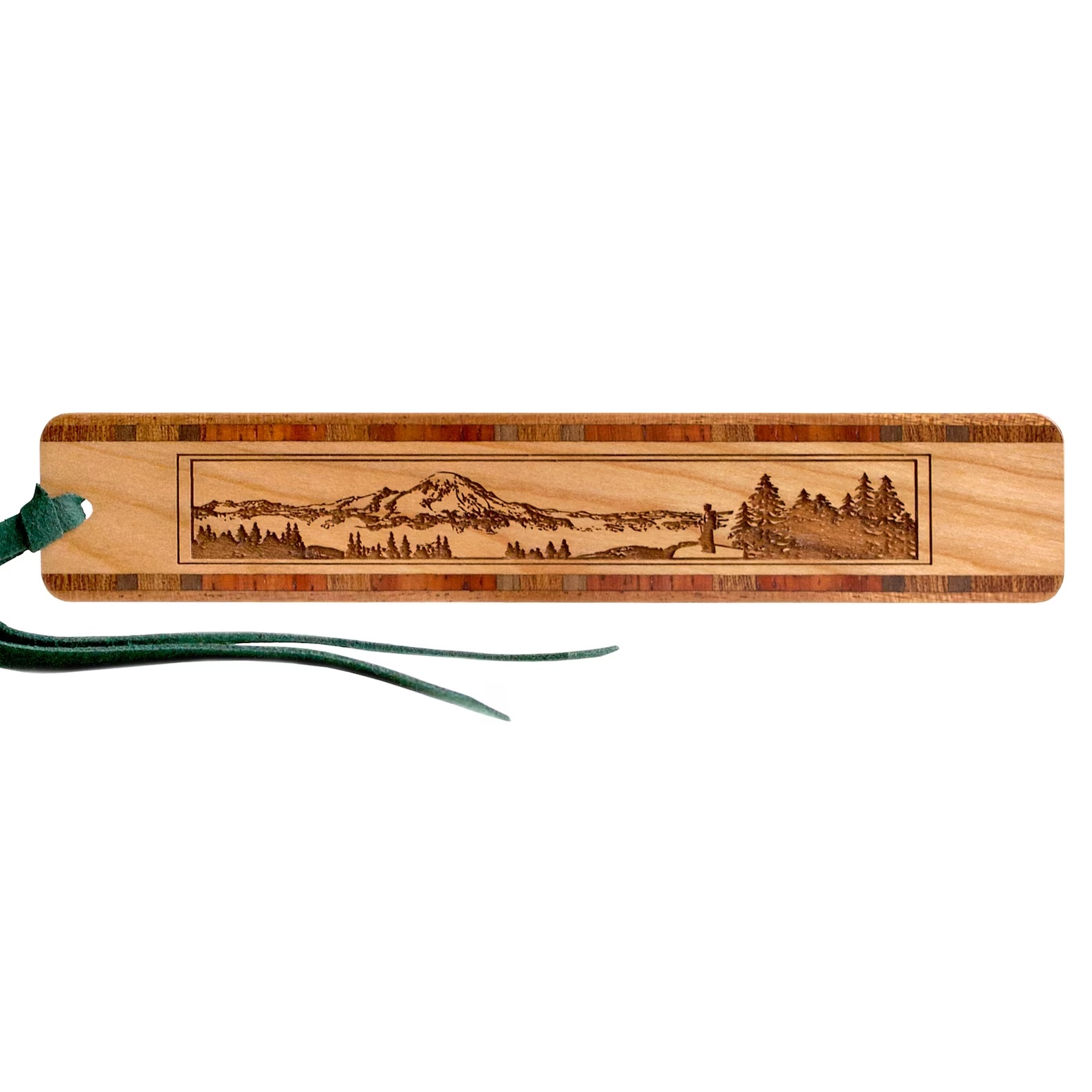 A photo of a wooden bookmark carves with a mountain scene on the front of it.
