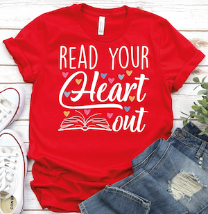 a red t-shirt with an opened book graphic illustration and text that says "read your heart out"