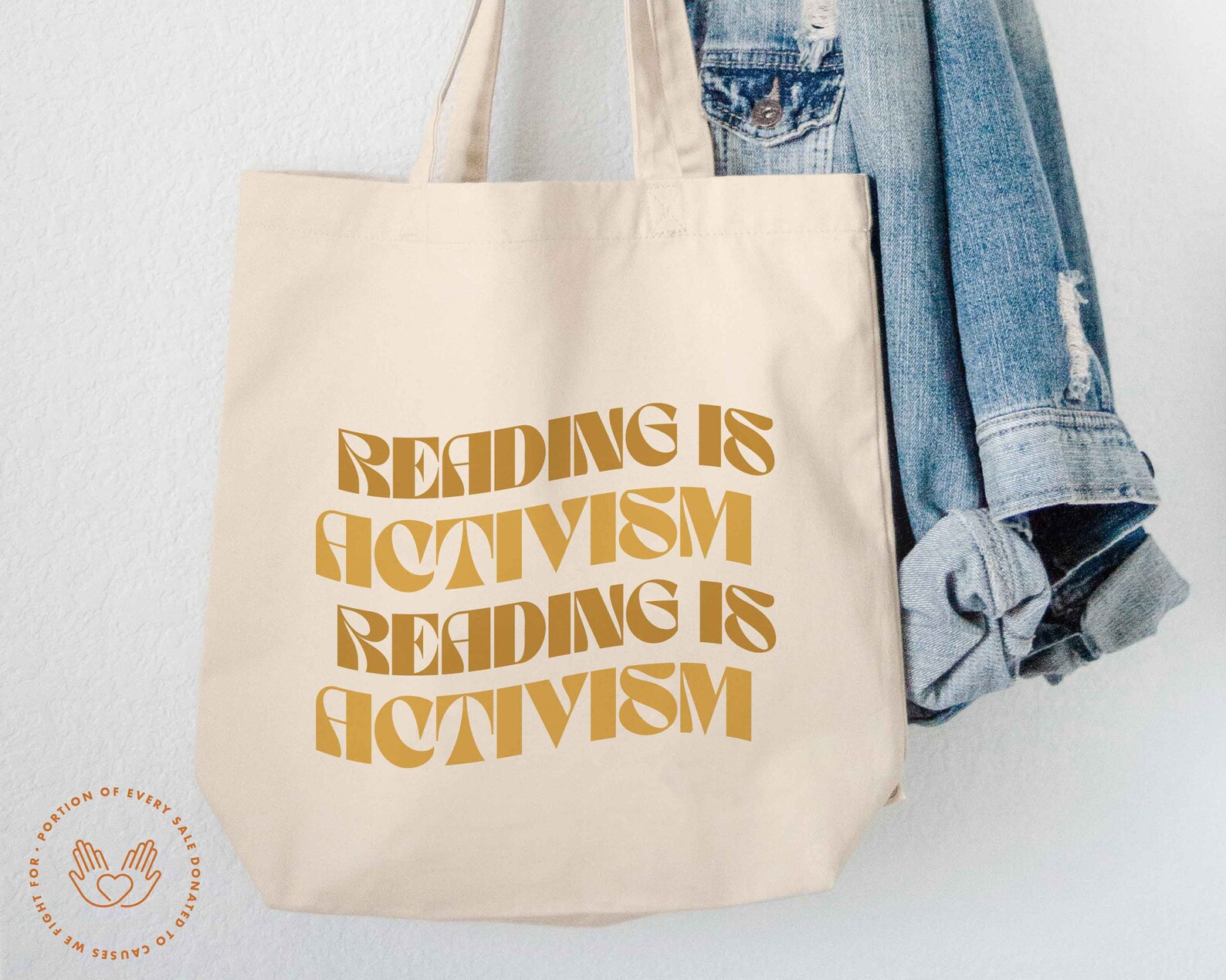 tote bag with vintage style font that says "reading is activism."