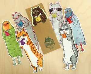 illustrated bookmarks of various animals each holding a book with their bodies extented comically 