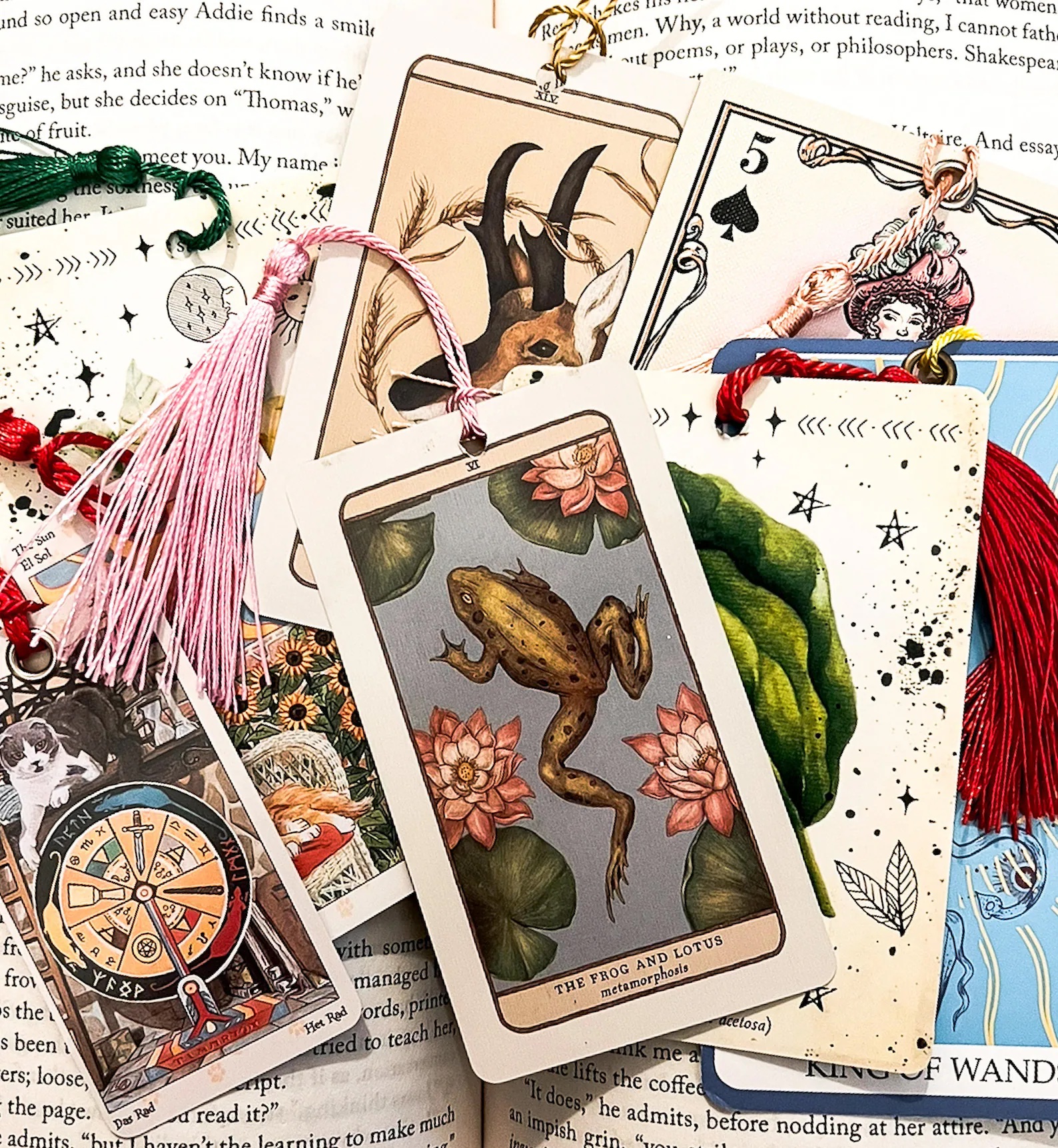 a photo of several bookmark made of tarot cards with tassels