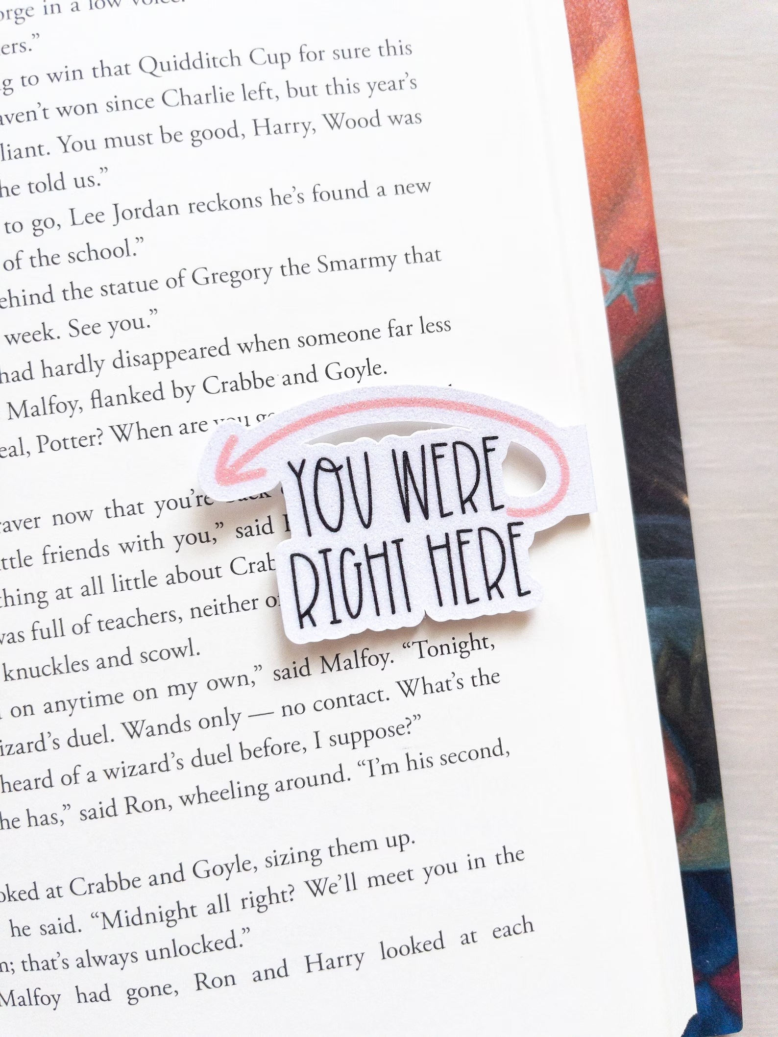 a photo of a bookmark that has an arrow next to text that reads "You Were Right Here" 