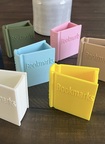 Book-shaped bookmark holders