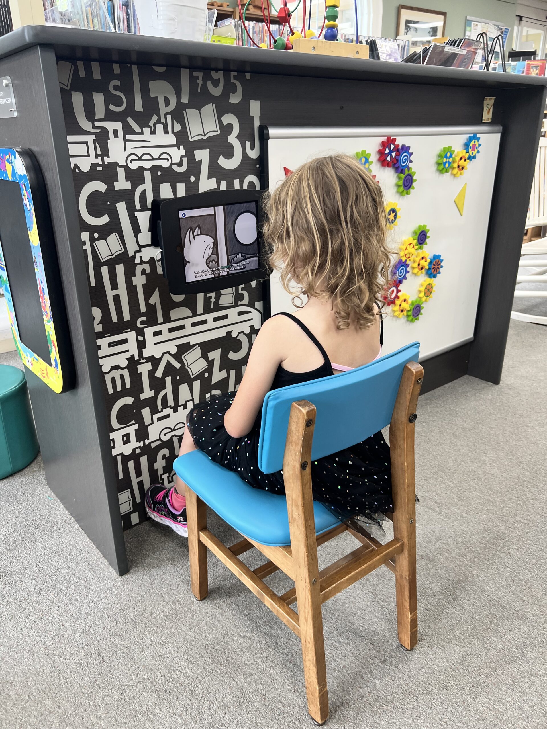 Marian reading at the library