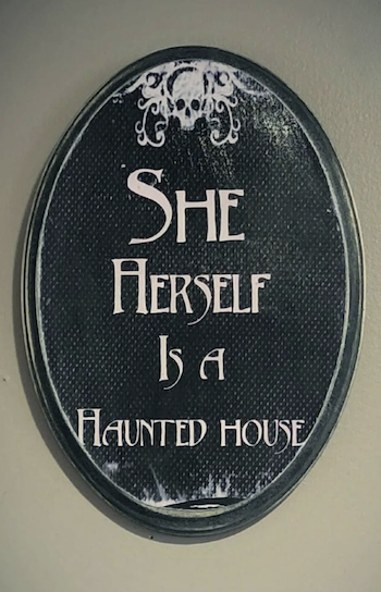 She Herself Is a Haunted House plaque